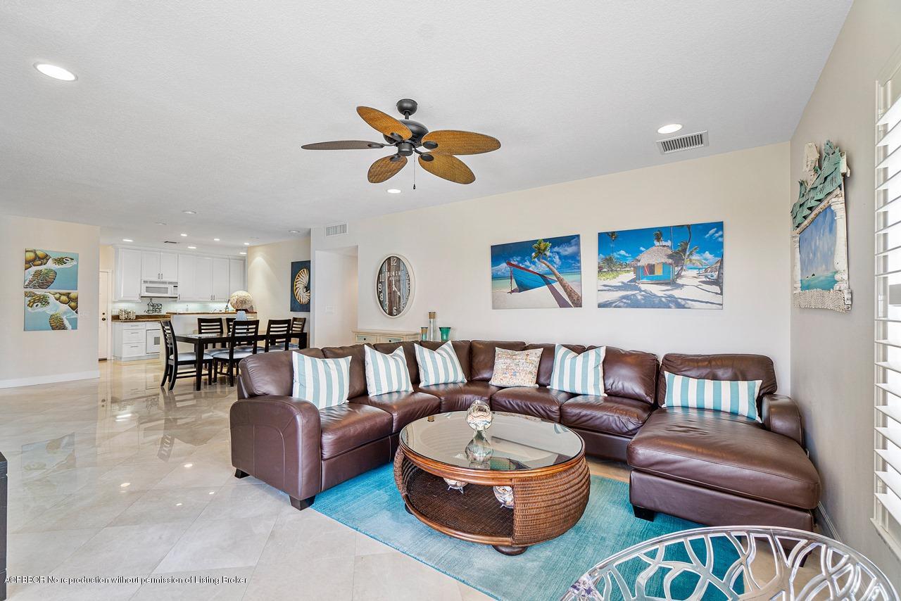 5900 Old Ocean Boulevard, Unit B1 Ocean Ridge, FL 33435 - Photo 6 of 26 a living room with furniture and a large window