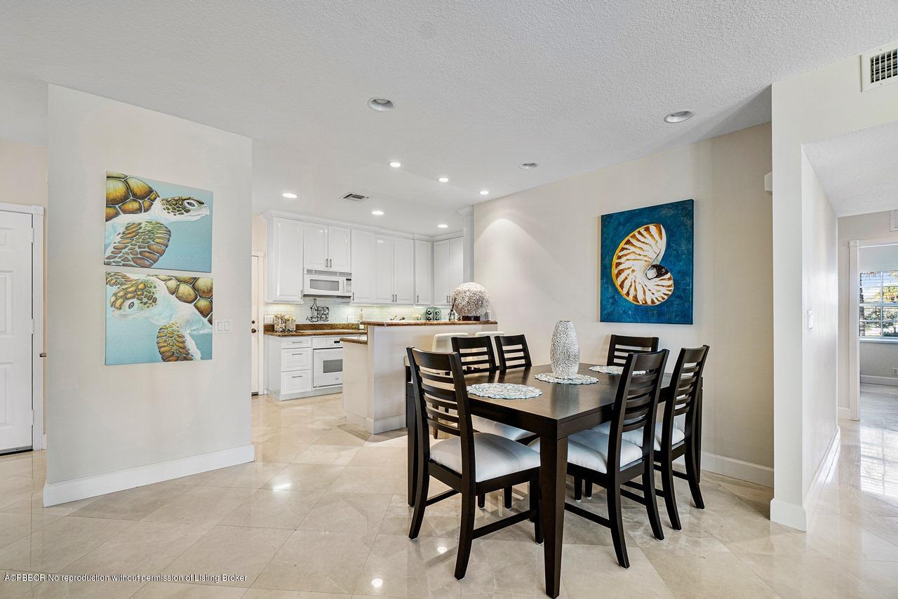 5900 Old Ocean Boulevard, Unit B1 Ocean Ridge, FL 33435 - Photo 8 of 26 a view of a dining room with furniture and wooden floor
