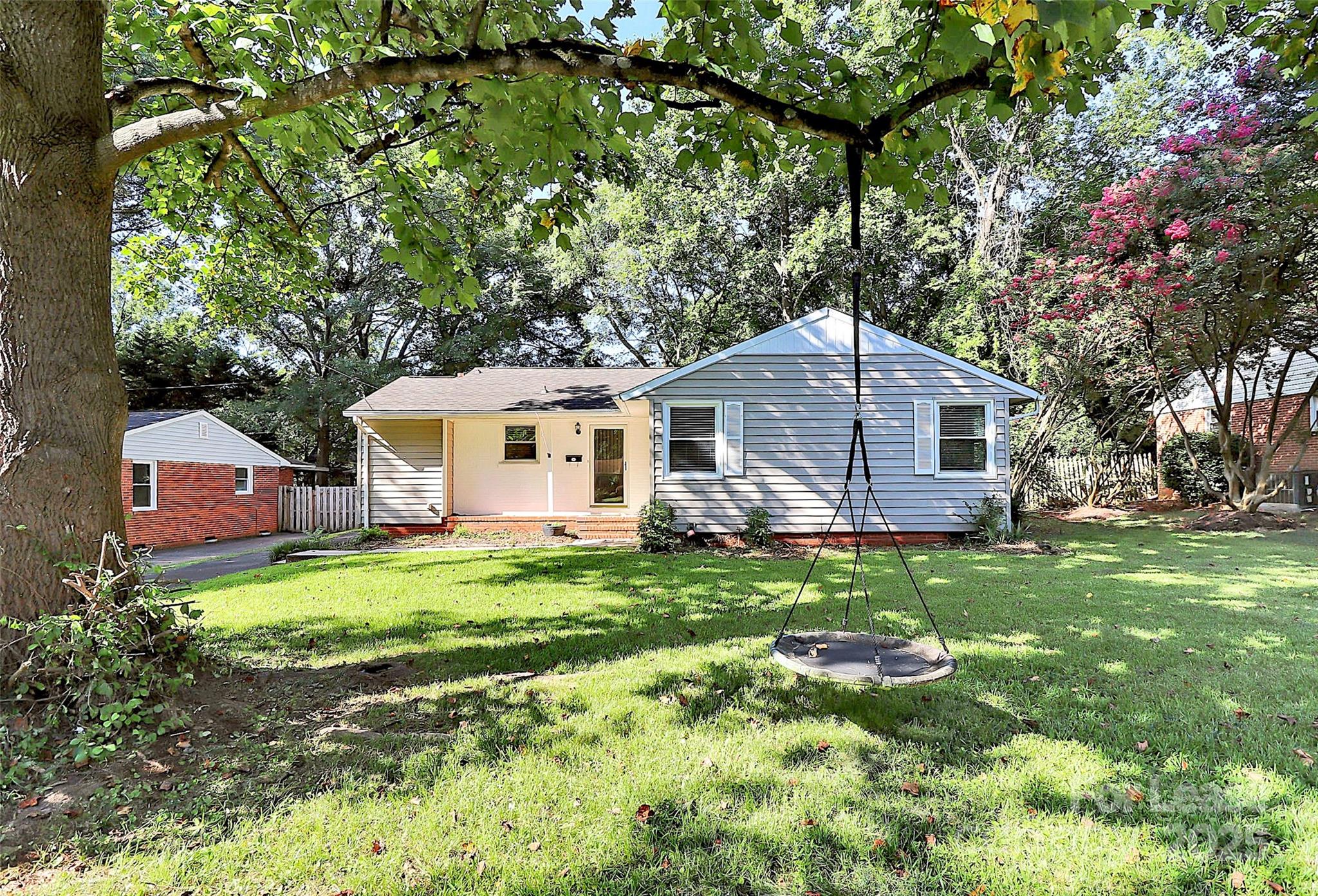 228 Seneca Place Charlotte, NC 28210 - Photo 2 of 34 a backyard of a house with table and chairs