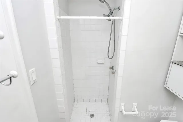 a bathroom with a glass shower door