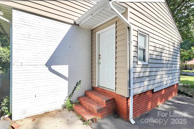 a view of sitting area in front of house