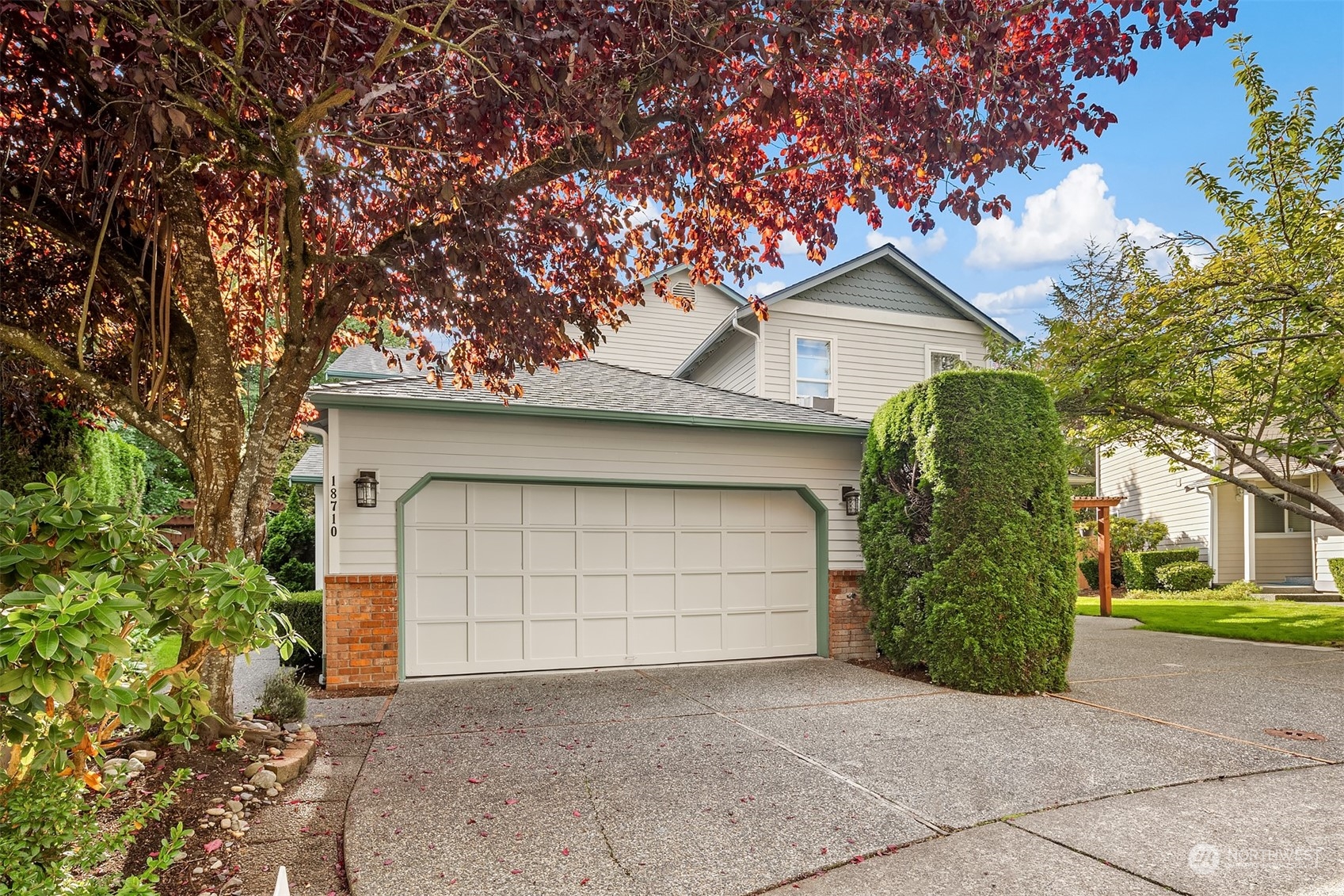 18710 20th Avenue Southeast Bothell, WA 98012 - Photo 1 of 40 a front view of a house with a yard and garage