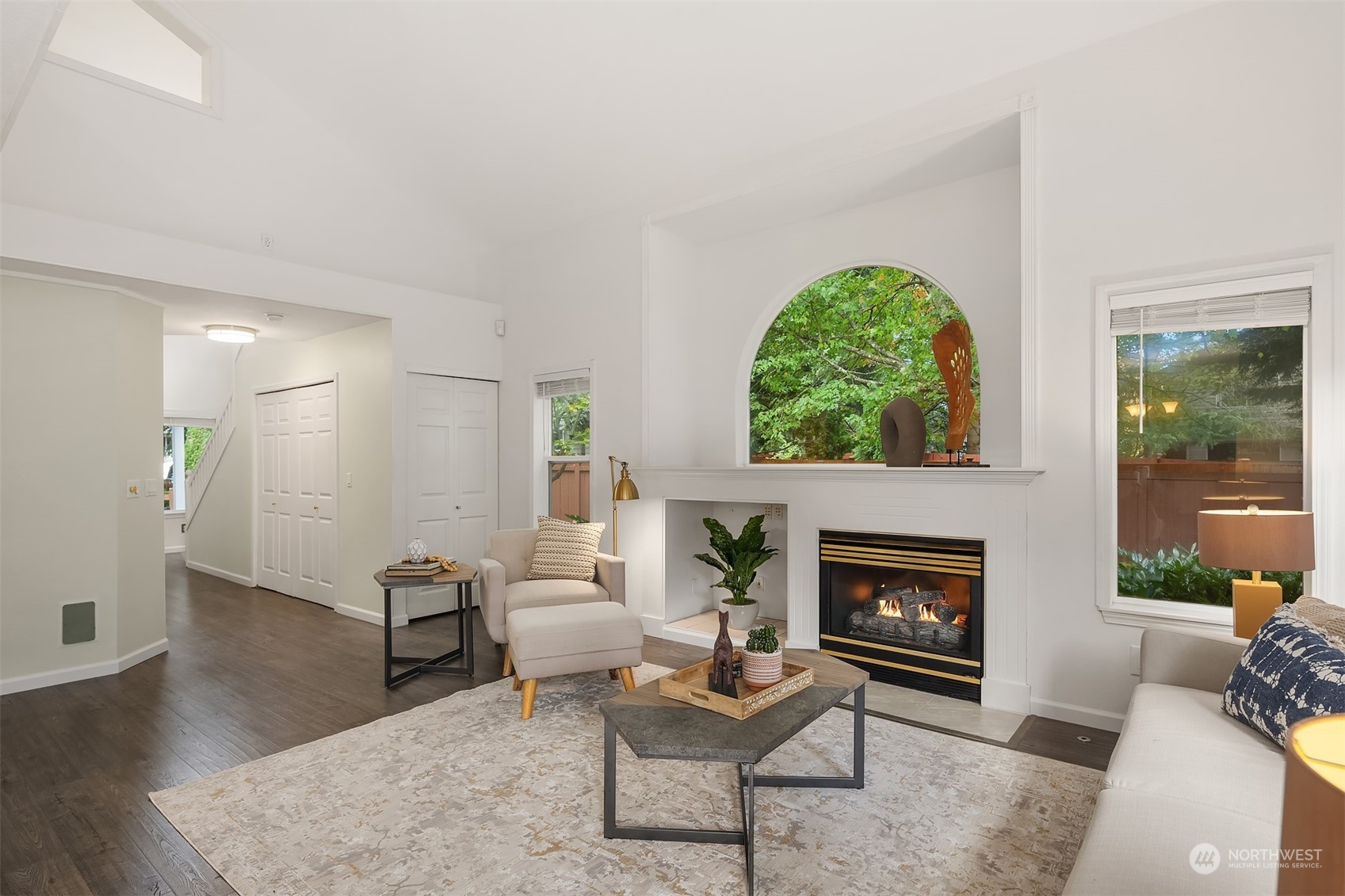 18710 20th Avenue Southeast Bothell, WA 98012 - Photo 12 of 40 a living room with furniture a window and a fireplace