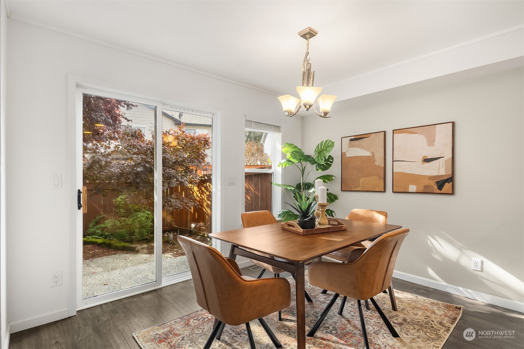 18710 20th Avenue Southeast Bothell, WA 98012 - Photo 17 of 40 a dining room with furniture wooden floor a chandelier