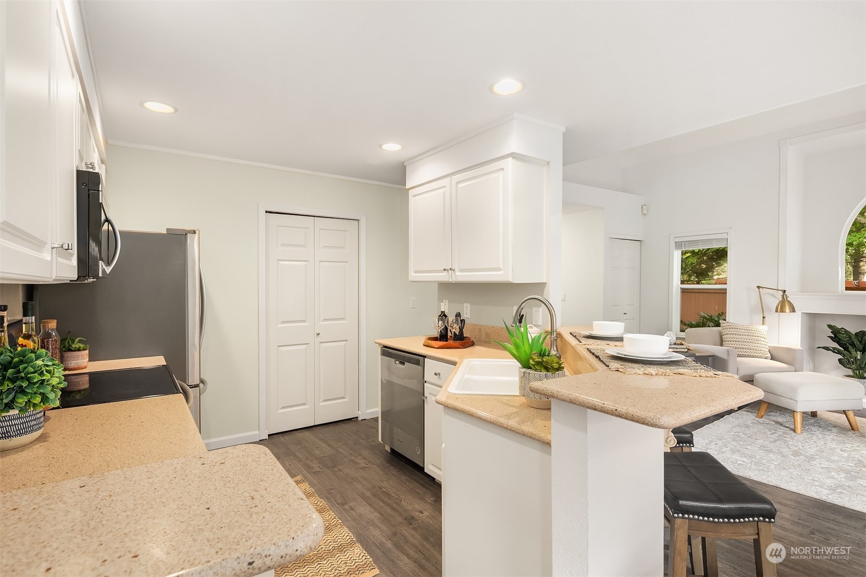 18710 20th Avenue Southeast Bothell, WA 98012 - Photo 22 of 40 a kitchen with a sink a stove cabinets and counter space
