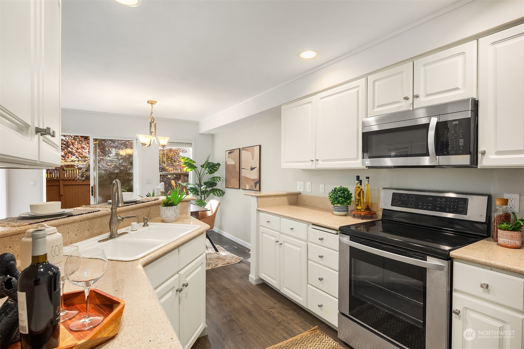 18710 20th Avenue Southeast Bothell, WA 98012 - Photo 23 of 40 a kitchen with a sink stove and microwave