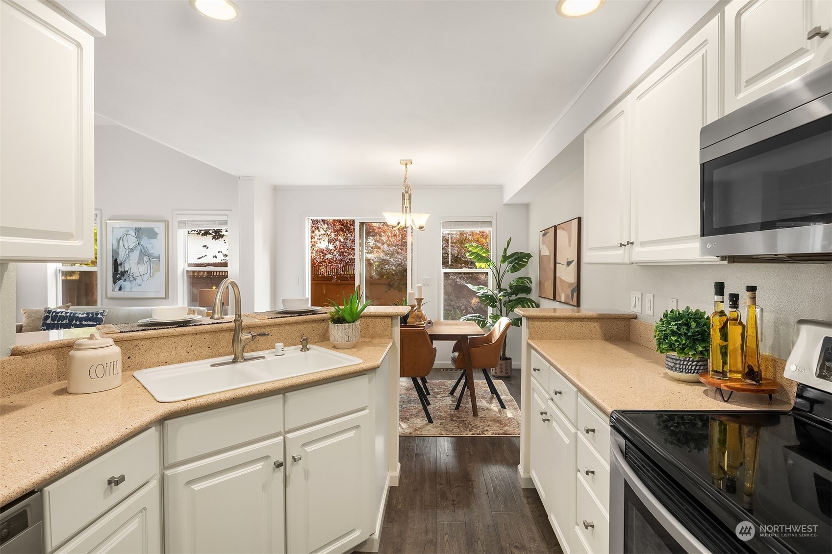18710 20th Avenue Southeast Bothell, WA 98012 - Photo 24 of 40 a kitchen with a sink stove and cabinets