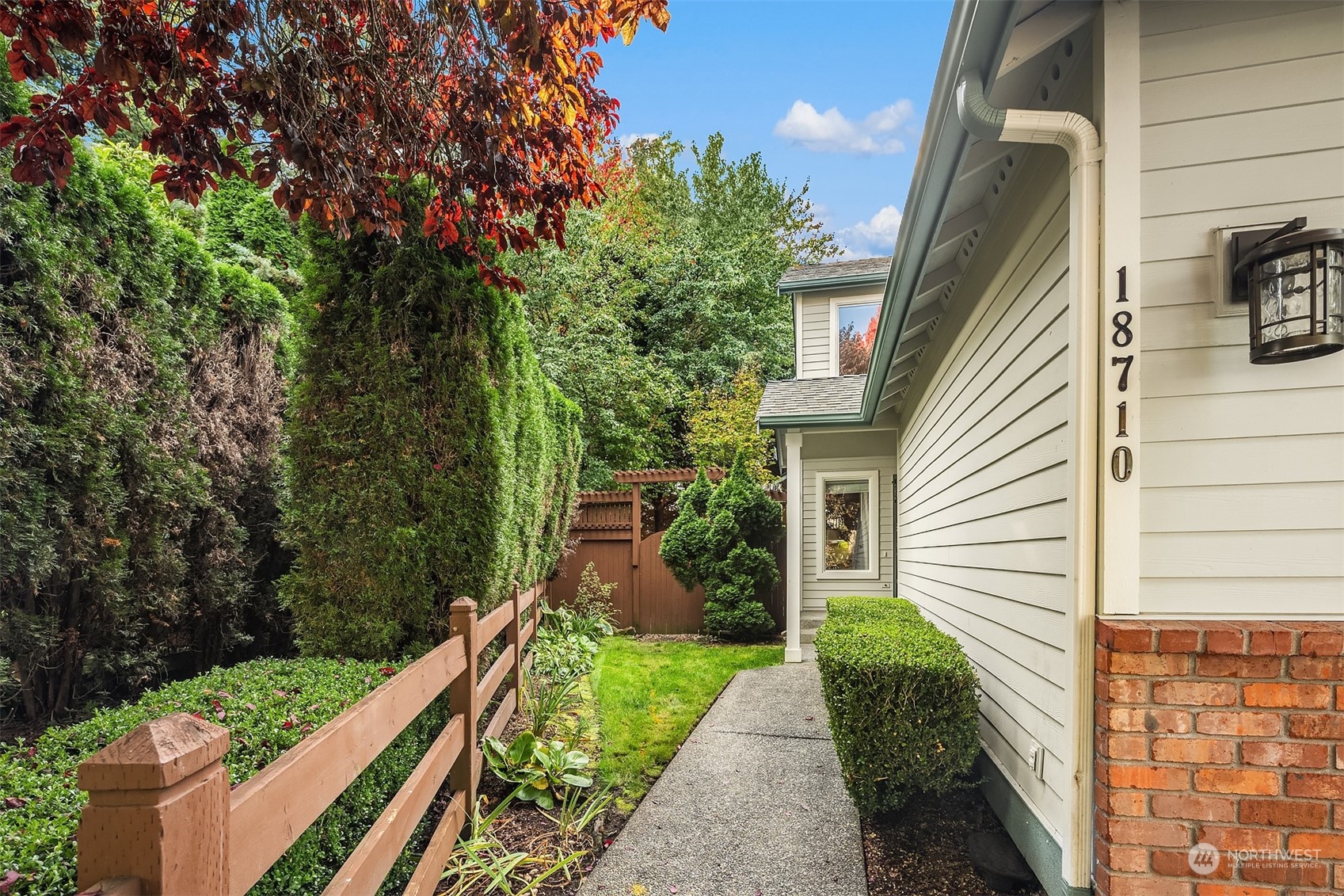 18710 20th Avenue Southeast Bothell, WA 98012 - Photo 3 of 40 a front view of a house with a yard