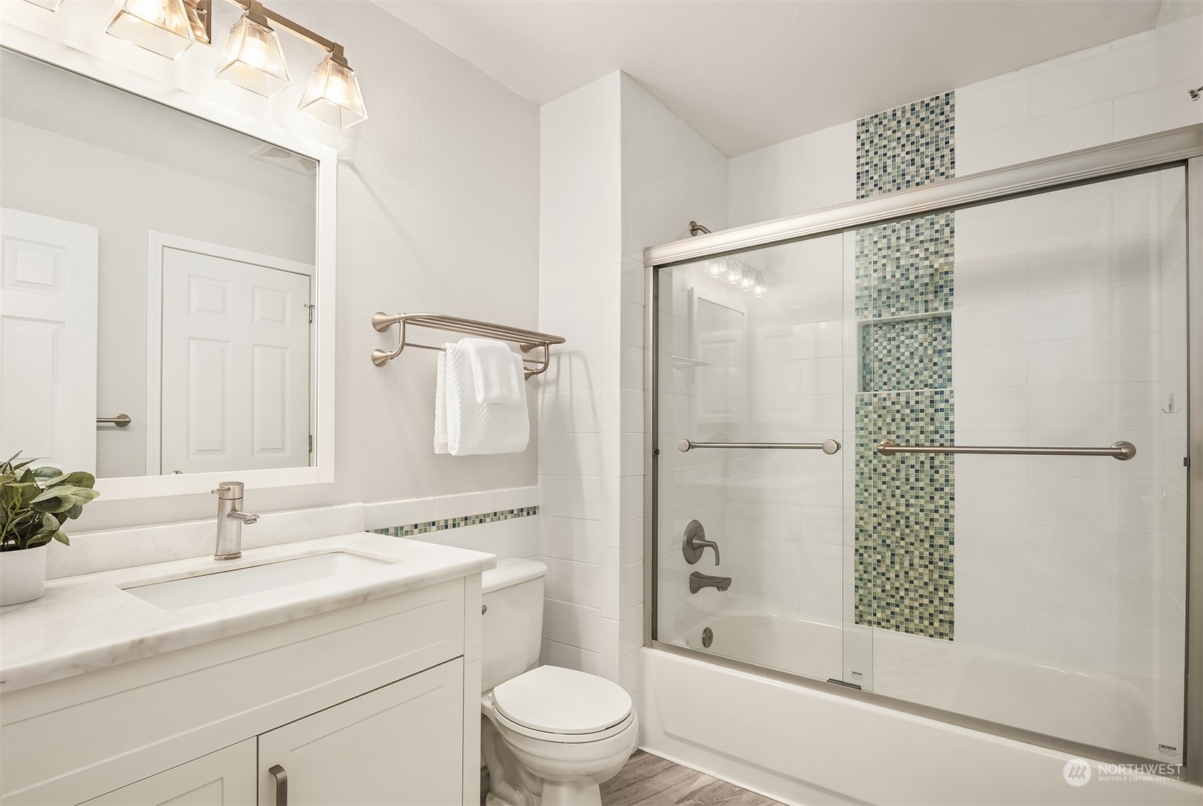 18710 20th Avenue Southeast Bothell, WA 98012 - Photo 31 of 40 a bathroom with a shower sink vanity mirror and toilet