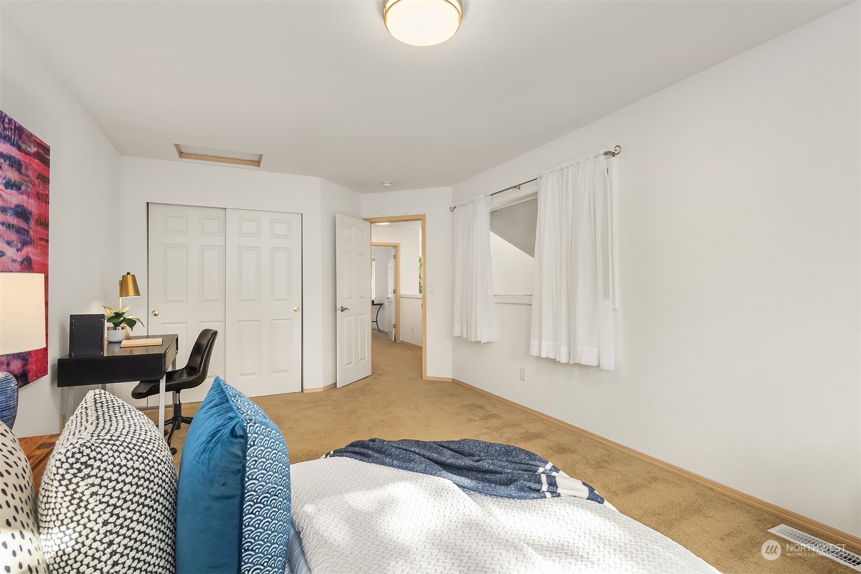 18710 20th Avenue Southeast Bothell, WA 98012 - Photo 33 of 40 a bedroom with a bed and a chair