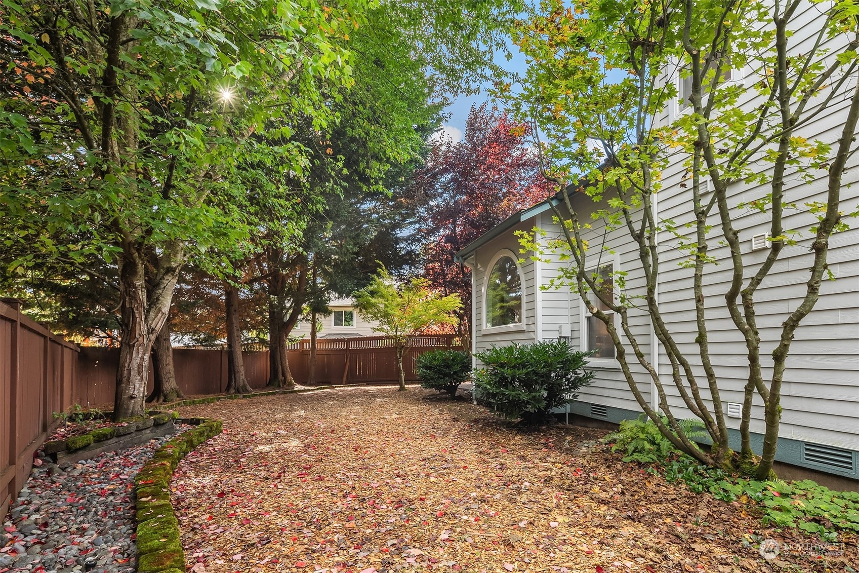 18710 20th Avenue Southeast Bothell, WA 98012 - Photo 34 of 40 a front view of a house with garden