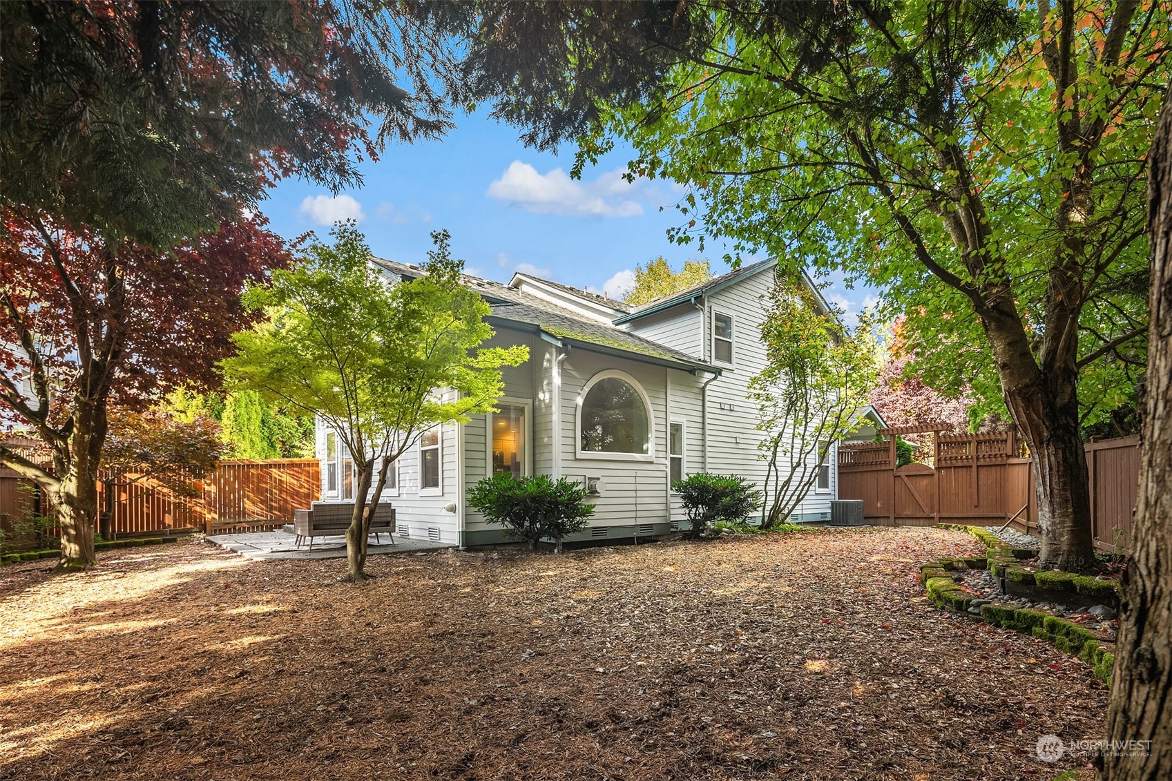 18710 20th Avenue Southeast Bothell, WA 98012 - Photo 35 of 40 a front view of a house with garden