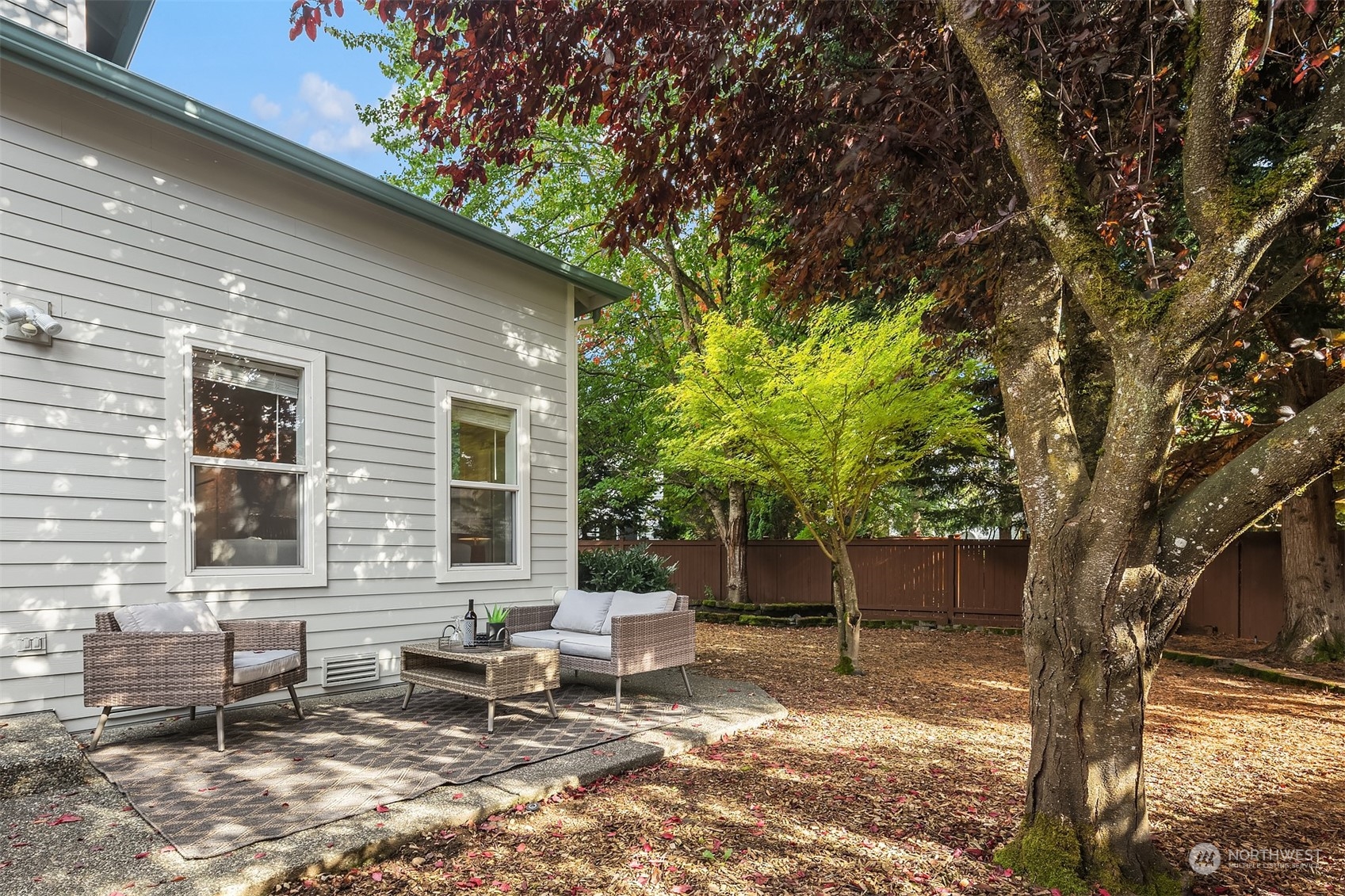 18710 20th Avenue Southeast Bothell, WA 98012 - Photo 37 of 40 a backyard of a house with outdoor seating