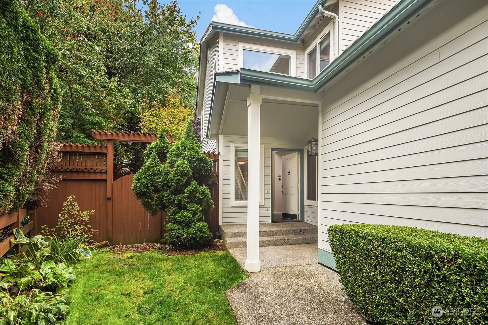 18710 20th Avenue Southeast Bothell, WA 98012 - Photo 4 of 40 a front view of a house with a yard and garage