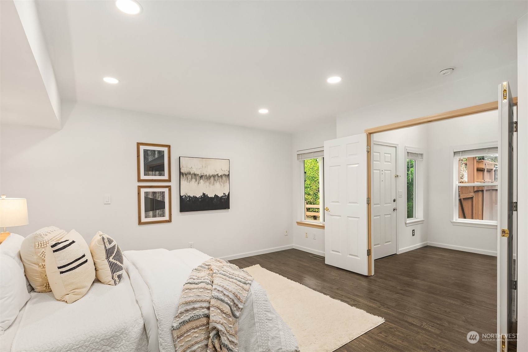 18710 20th Avenue Southeast Bothell, WA 98012 - Photo 7 of 40 a bedroom with a bed and wooden floor