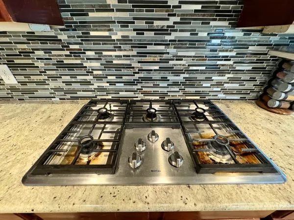 a refrigerator freezer sitting inside of a kitchen