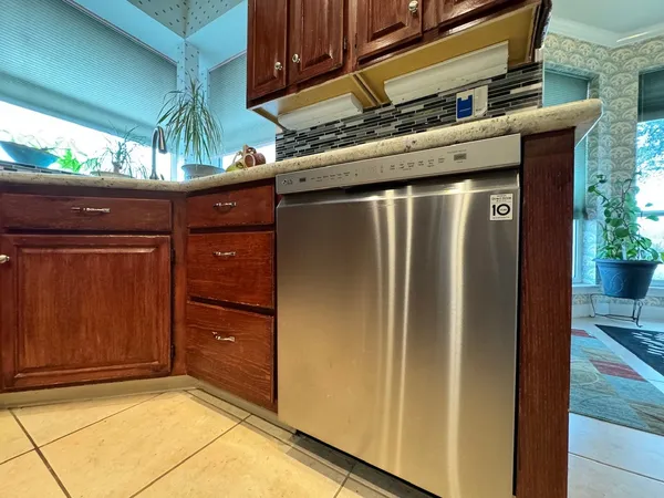a kitchen with wooden cabinets