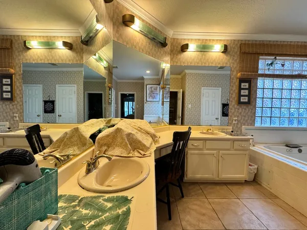 a bathroom with a tub and a window