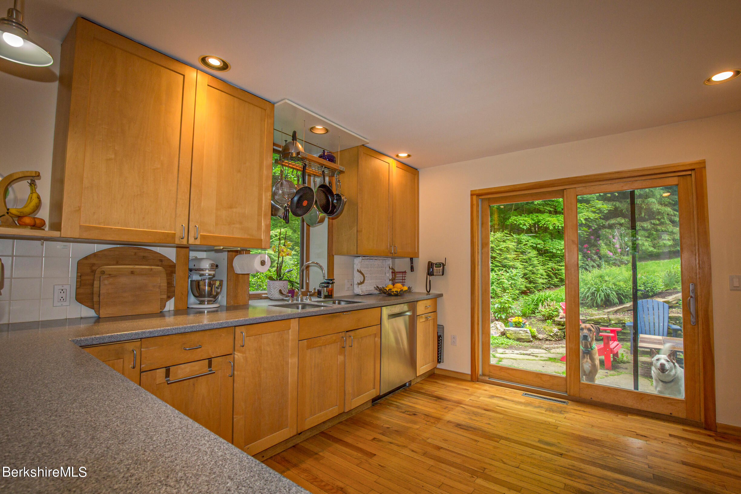 39 Lake Rd Extension Richmond, MA 01201 - Photo 18 of 47 a kitchen with stainless steel appliances granite countertop a sink a stove and a wooden cabinets