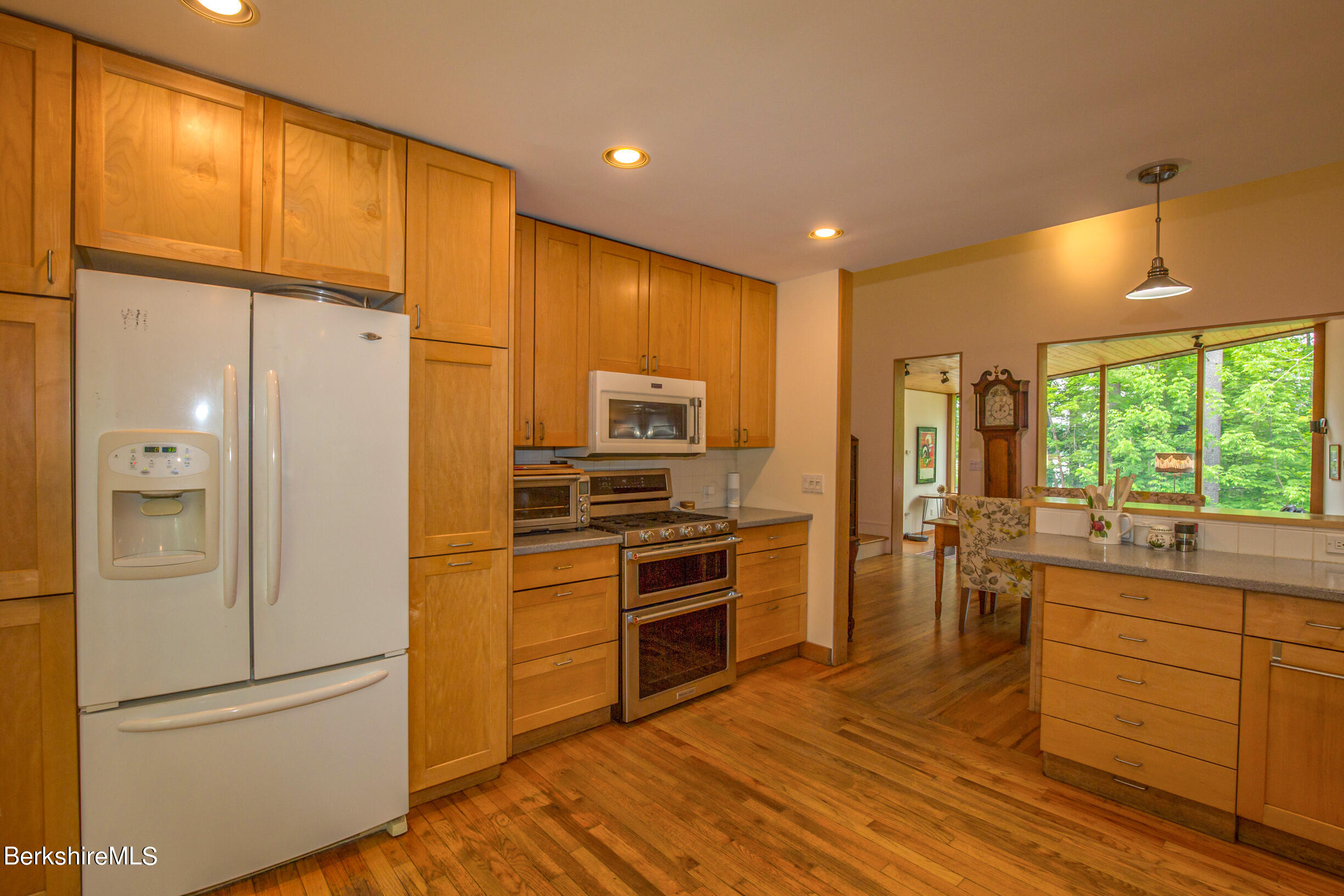 39 Lake Rd Extension Richmond, MA 01201 - Photo 19 of 47 a kitchen with a refrigerator a sink and cabinets