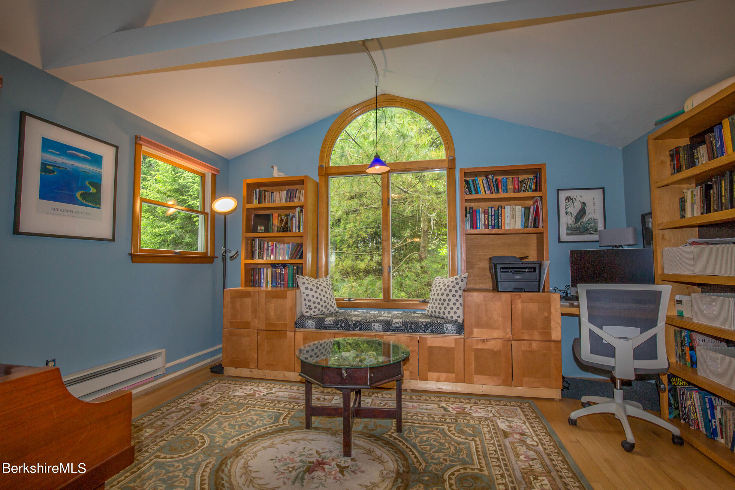 39 Lake Rd Extension Richmond, MA 01201 - Photo 36 of 47 a living room with furniture a bookshelf and a window