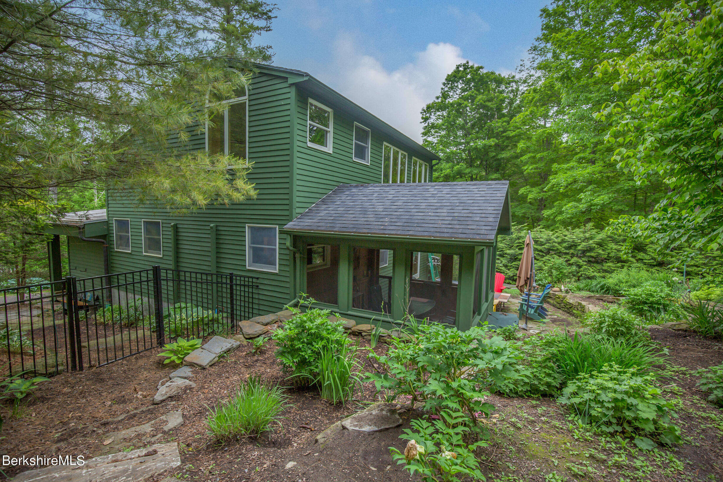 39 Lake Rd Extension Richmond, MA 01201 - Photo 45 of 47 a front view of a house with garden