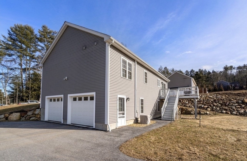 64 Town Farm Road Barre, MA 01005 - Photo 2 of 24 a view of a house with a snow in the background