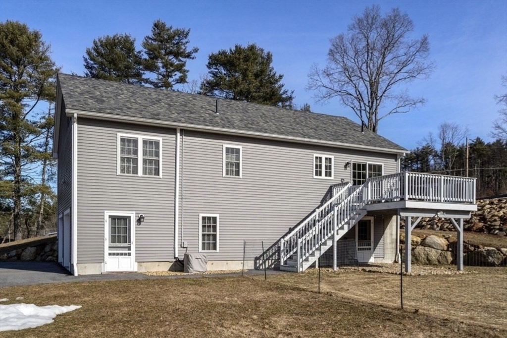 64 Town Farm Road Barre, MA 01005 - Photo 3 of 24 a front view of a house with a park