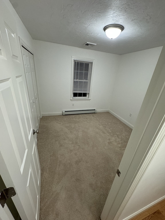 64 Town Farm Road Barre, MA 01005 - Photo 9 of 24 an empty room with a door