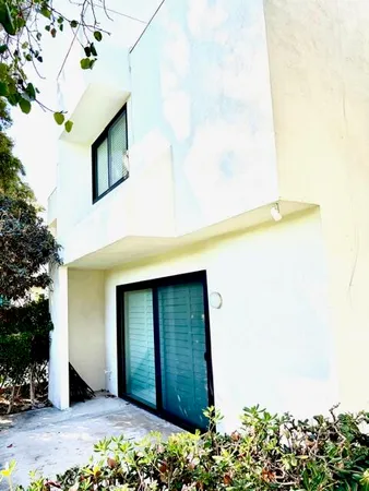 a view of swimming pool with outdoor seating and city view