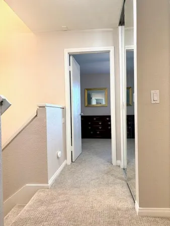 a view of a cabinet and a mirror