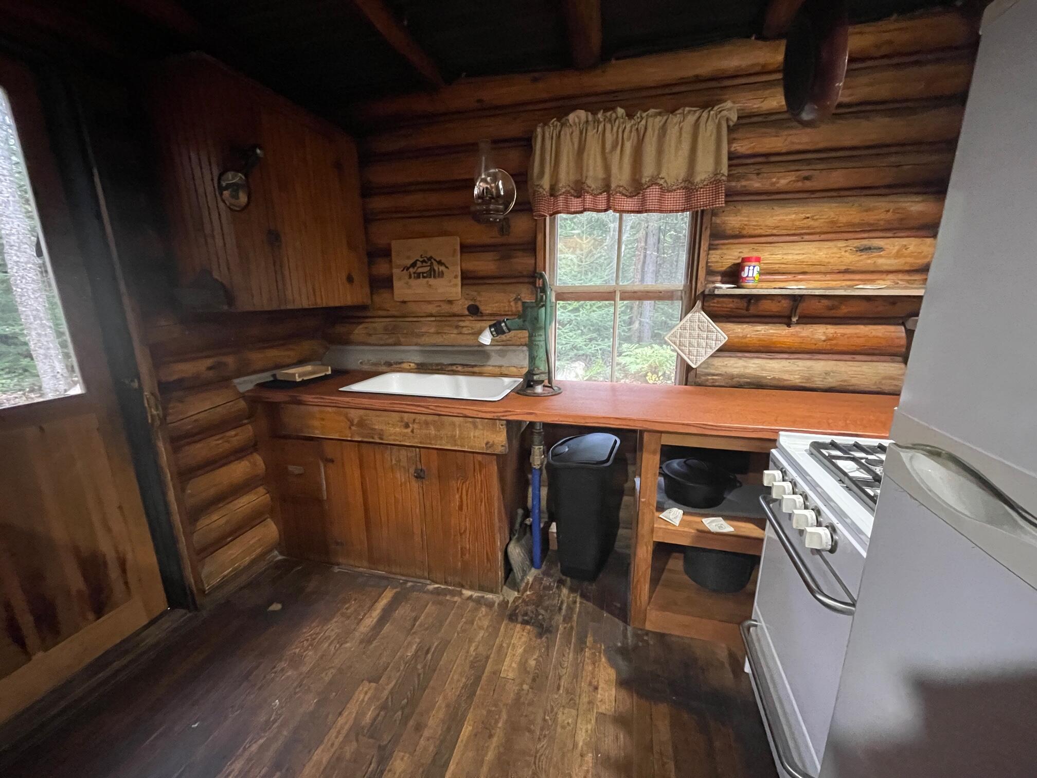 61 South Dike Road Oquossoc, ME 04964 - Photo 5 of 22 Kitchen - Hand Pump