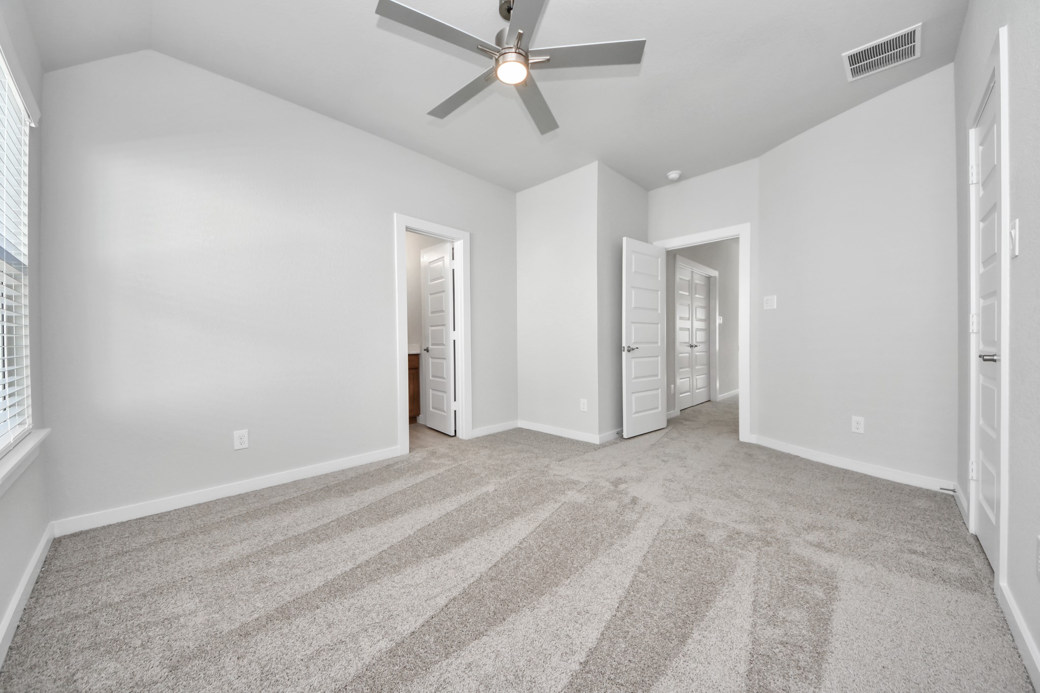 3102 Native Spg Drive Spring, TX 77373 - Photo 27 of 40 Generously sized secondary bedrooms featuring spacious closets, soft and inviting carpeting underfoot, large windows allowing plenty of natural light, and the added touch of privacy blinds for your personal retreat. Sample photo of completed home with similar floor plan. Actual colors and selections may vary.