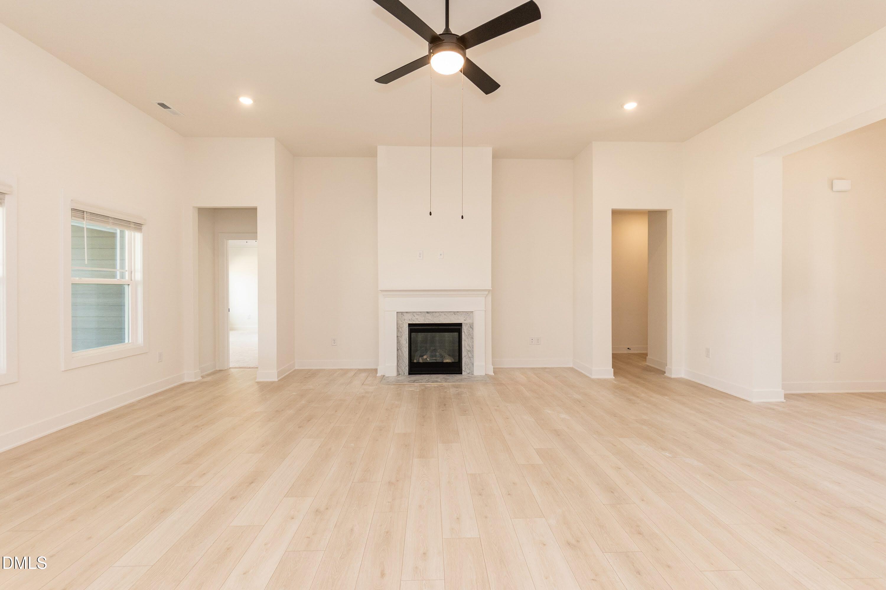 180 Galway Road Lillington, NC 27546 - Photo 20 of 41 a view of a livingroom with a fireplace and window