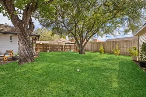 a view of house with backyard