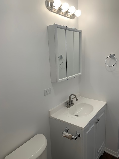 1655 Felten Road Aurora, IL 60505 - Photo 24 of 29 a bathroom with a sink toilet and mirror