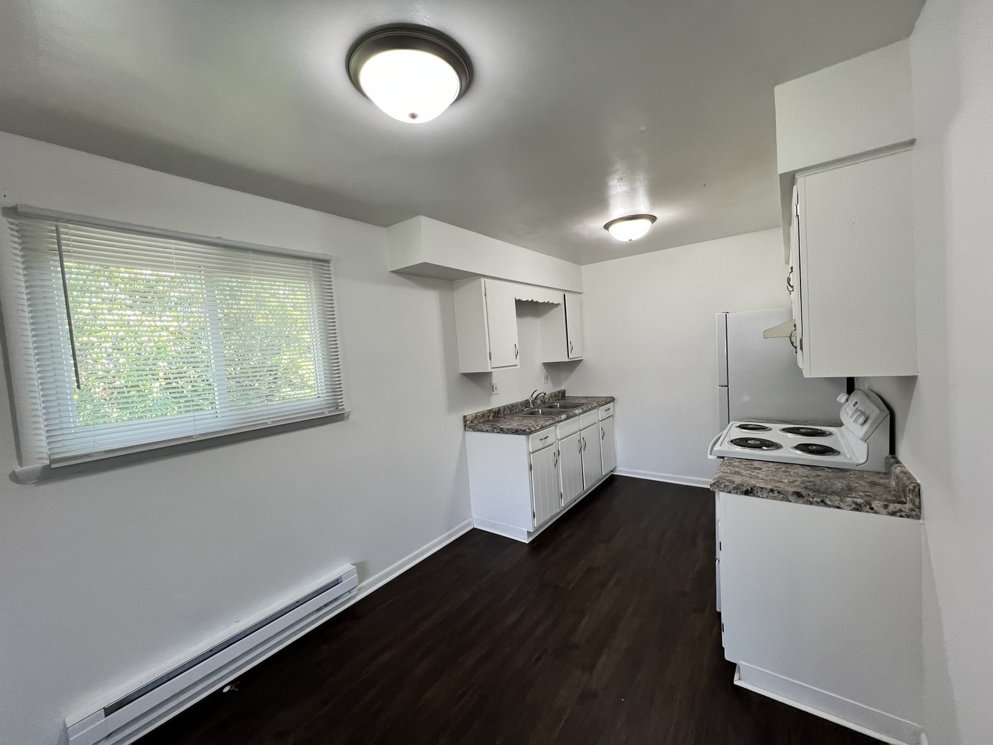 1655 Felten Road Aurora, IL 60505 - Photo 7 of 29 a kitchen with a stove and a white refrigerator
