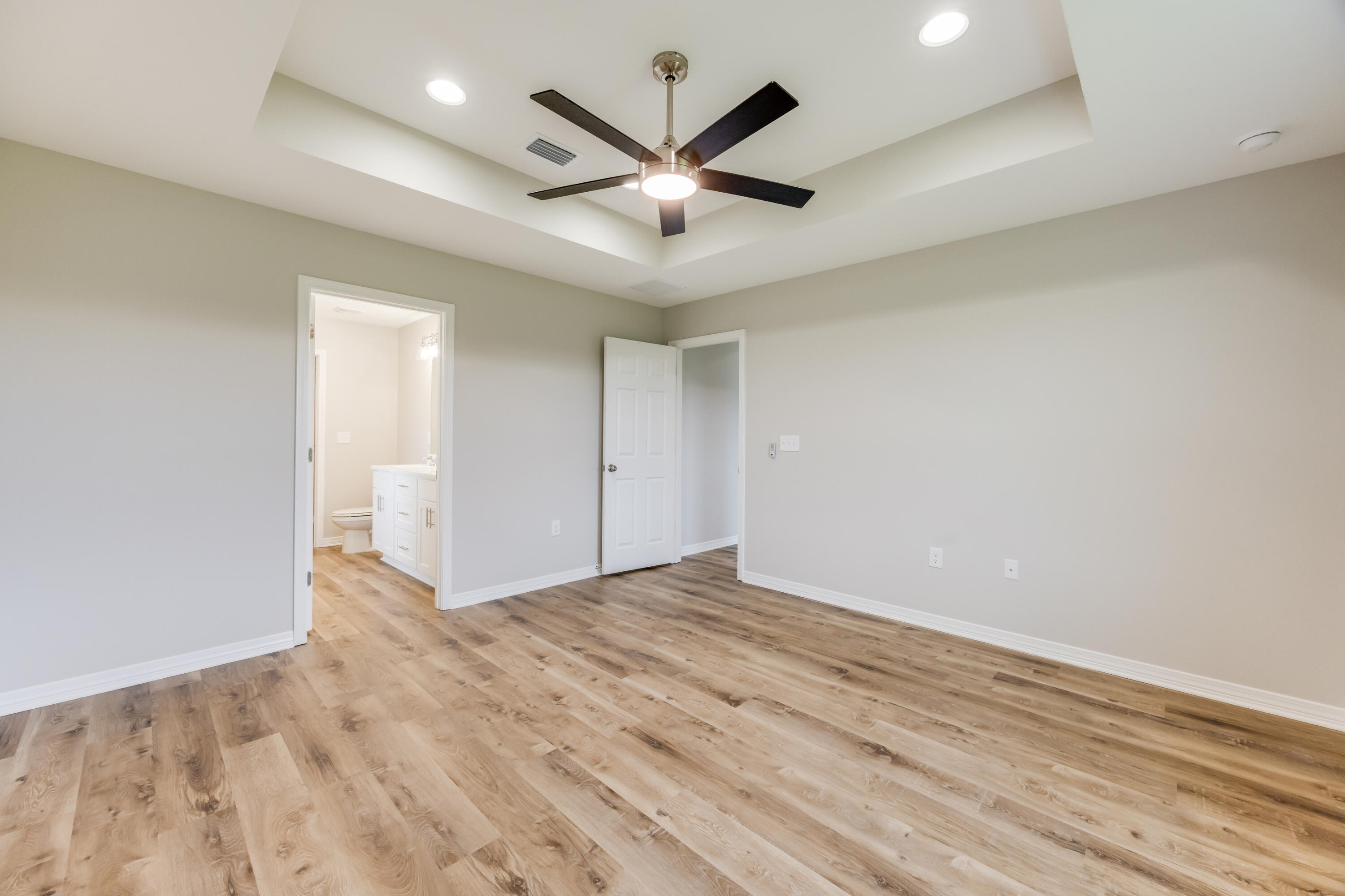 3203 Liz Court Crestview, FL 32539 - Photo 19 of 35 an empty room with ceiling fan and windows