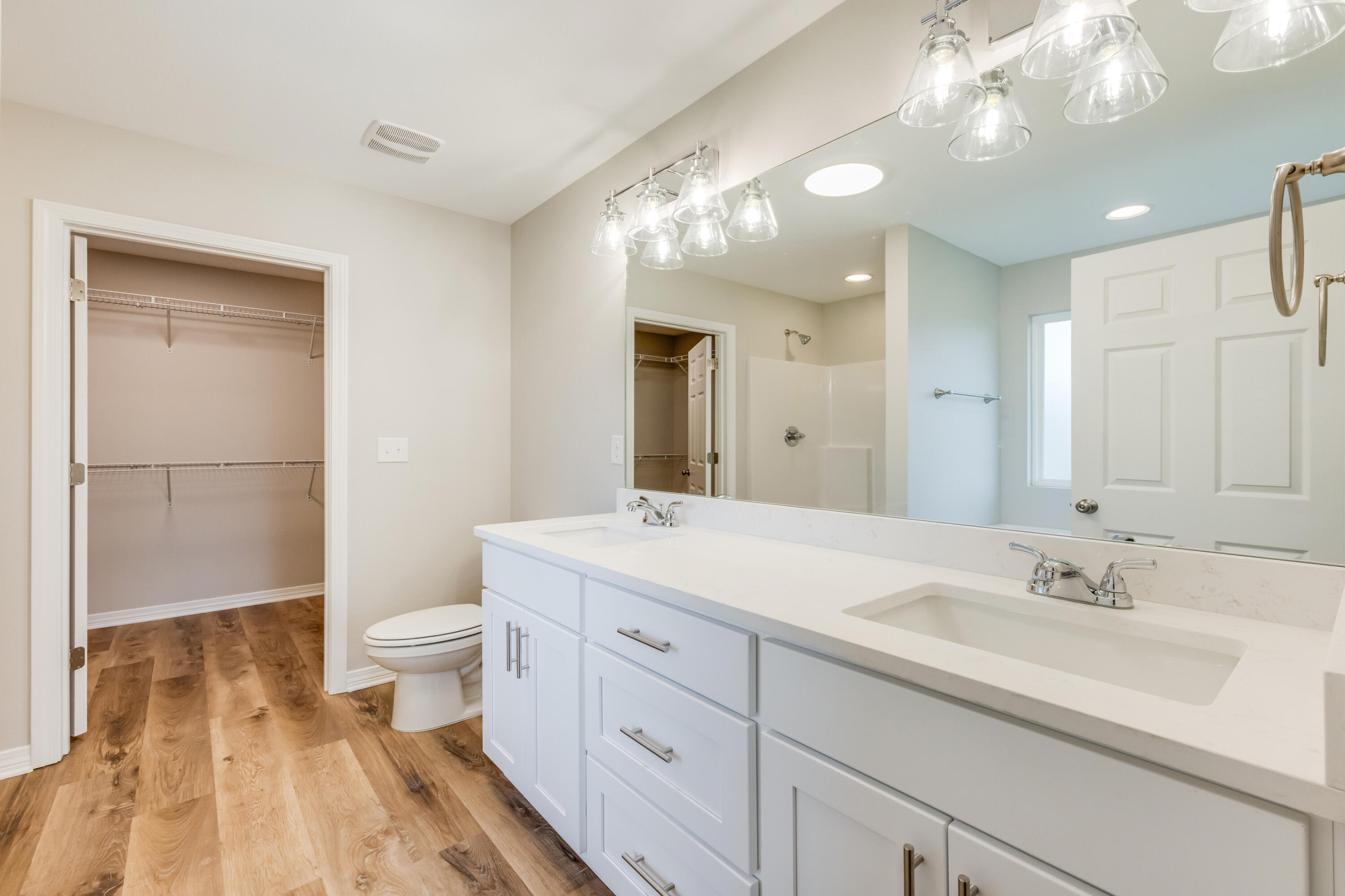 3203 Liz Court Crestview, FL 32539 - Photo 20 of 35 a bathroom with a sink a toilet and a large mirror