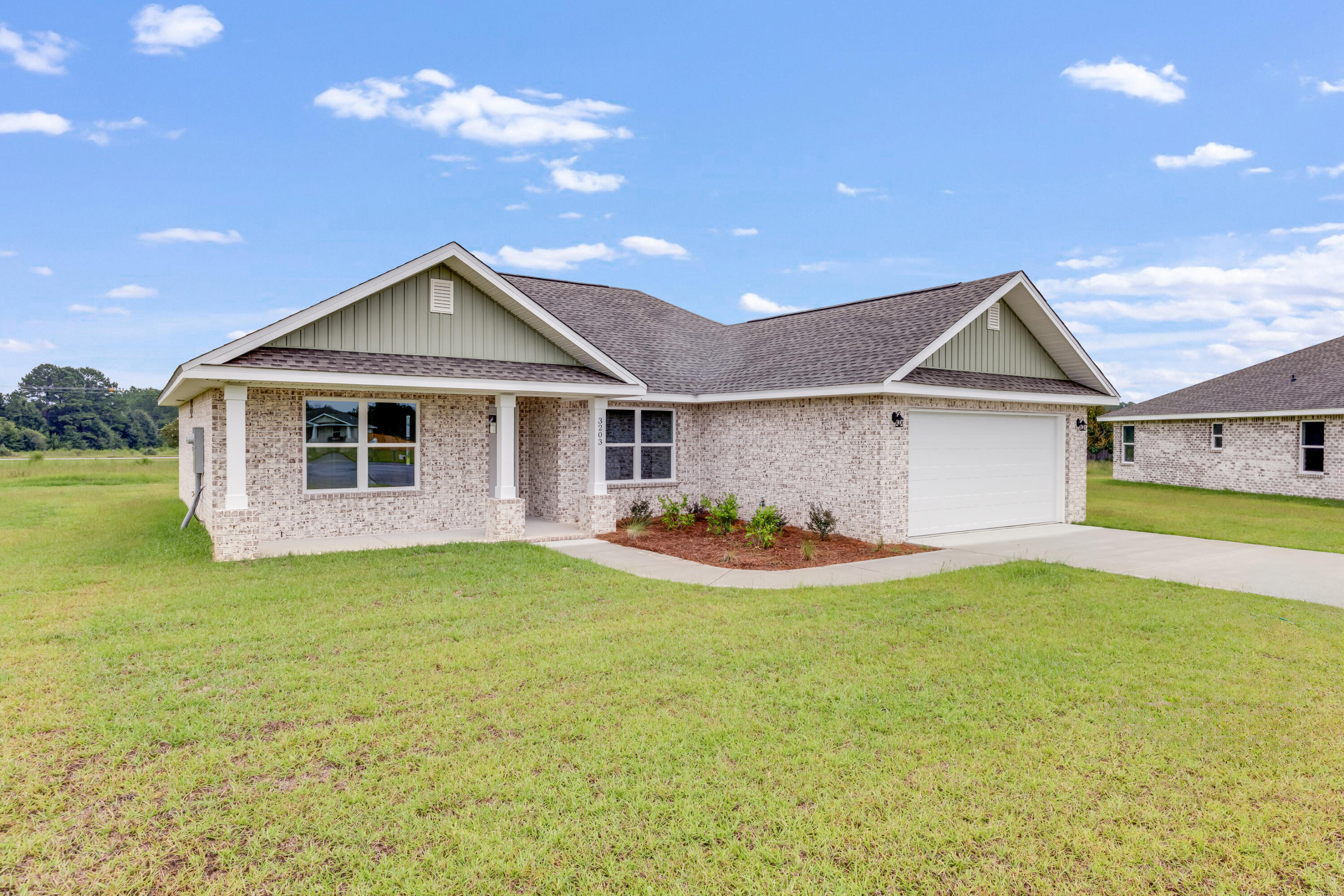3203 Liz Court Crestview, FL 32539 - Photo 2 of 35 a front view of a house with a yard and garage