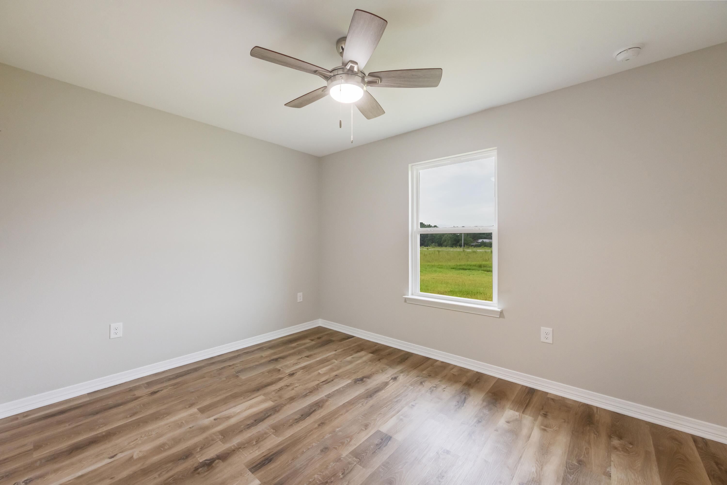 3203 Liz Court Crestview, FL 32539 - Photo 28 of 35 an empty room with a window and a fan