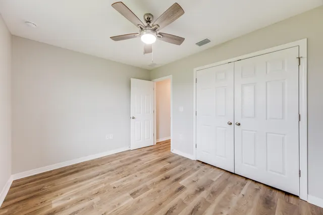 a bathroom with a sink toilet a mirror and bathtub