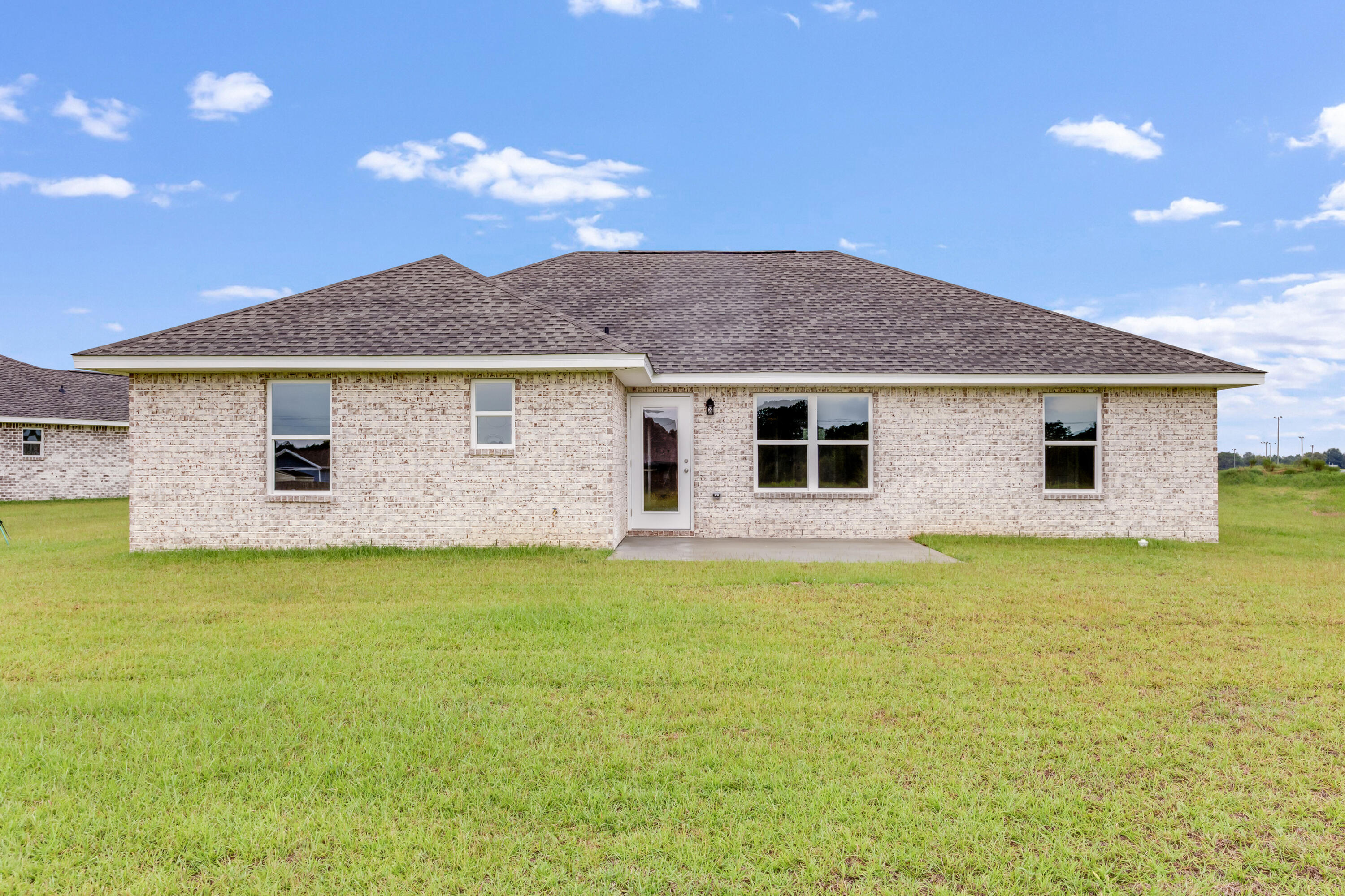 3203 Liz Court Crestview, FL 32539 - Photo 33 of 35 a front view of a house with a garden