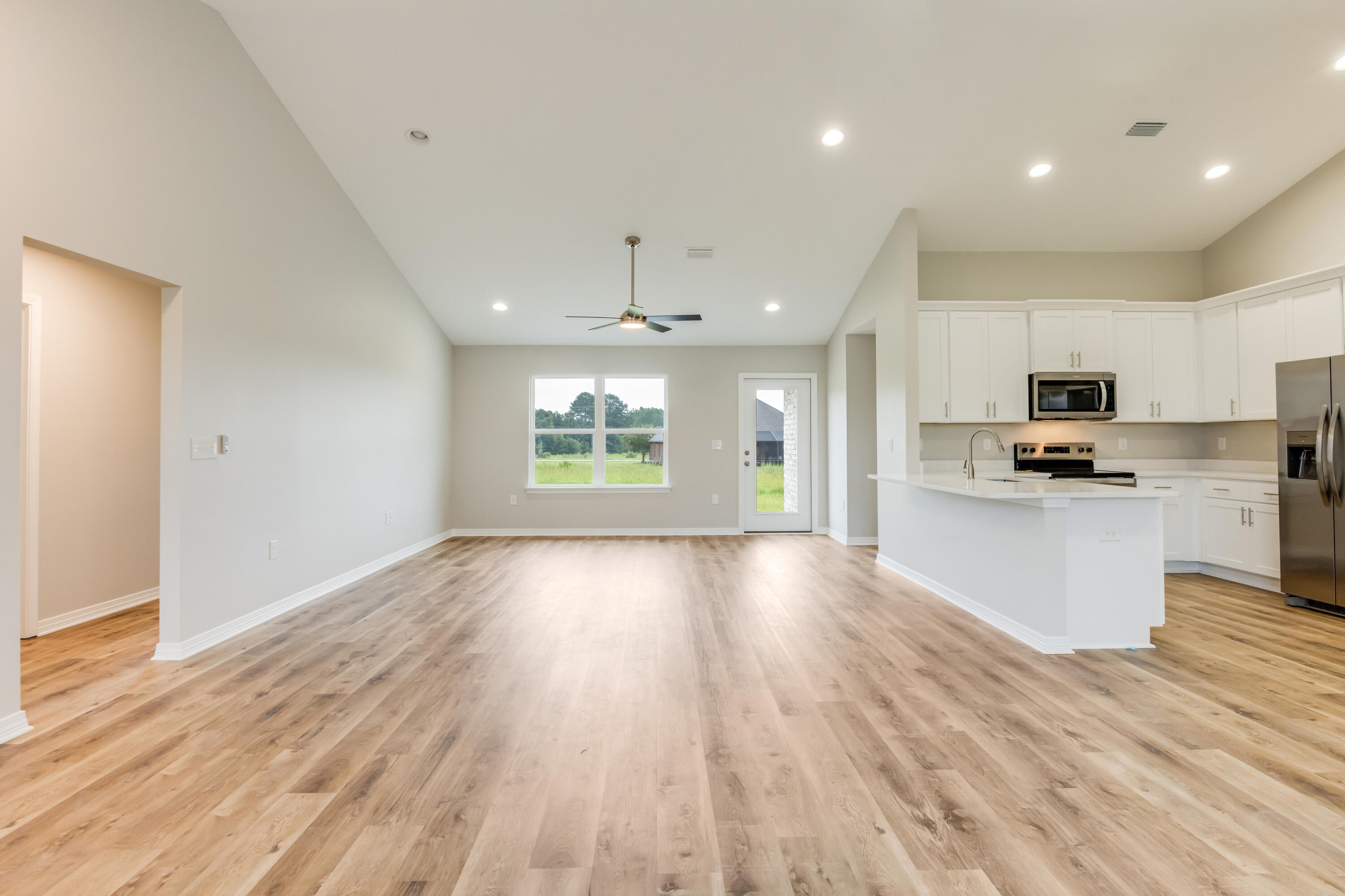 3203 Liz Court Crestview, FL 32539 - Photo 5 of 35 a view of kitchen with granite countertop cabinets and wooden floor