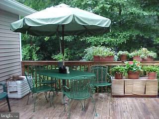 10 Moonraker Road Ocean Pines, MD 21811 - Photo 2 of 6 a view of a chair and table in backyard of the house