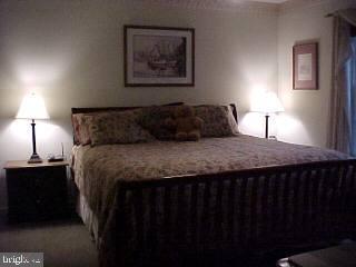 10 Moonraker Road Ocean Pines, MD 21811 - Photo 5 of 6 a bedroom with a bed and a night stand