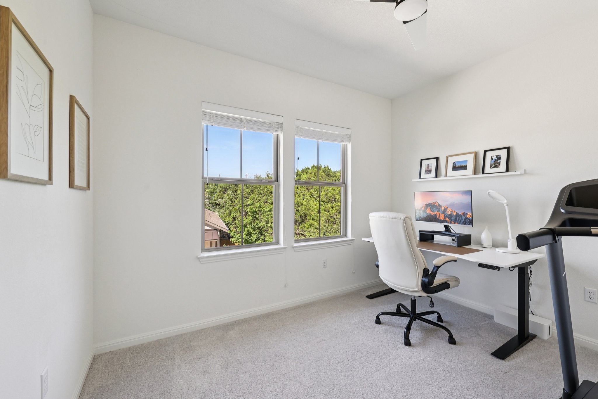 12500 Simmental Drive Austin, TX 78732 - Photo 13 of 31 a view of a workspace with furniture and a window