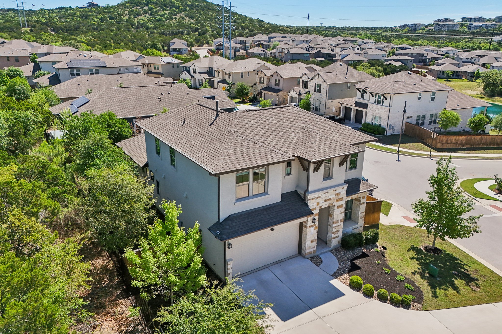 12500 Simmental Drive Austin, TX 78732 - Photo 17 of 31 an aerial view of a house with a yard and lake view
