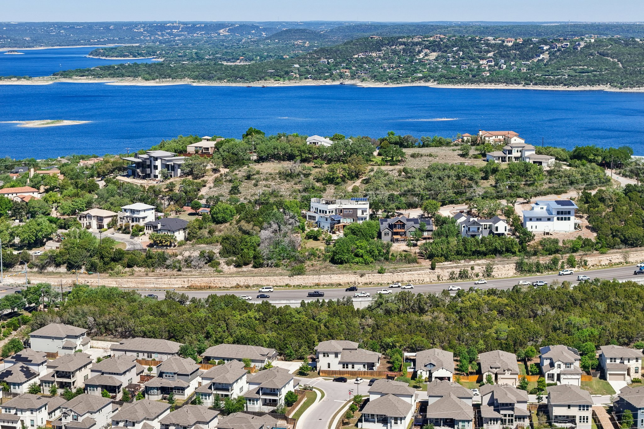 12500 Simmental Drive Austin, TX 78732 - Photo 19 of 31 an aerial view of residential building and lake
