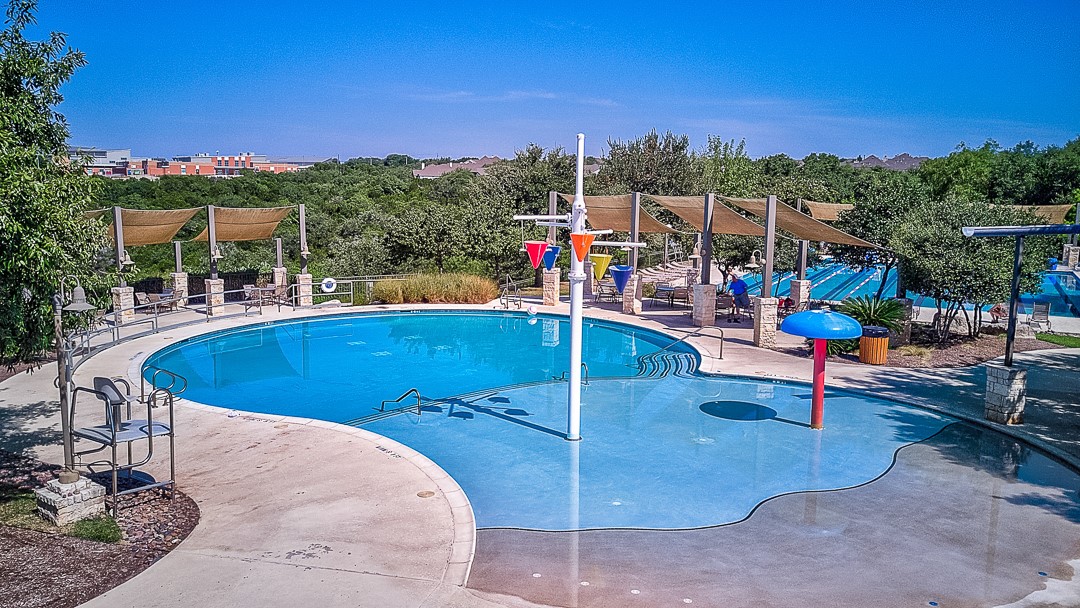 12500 Simmental Drive Austin, TX 78732 - Photo 25 of 31 a view of a swimming pool with a patio